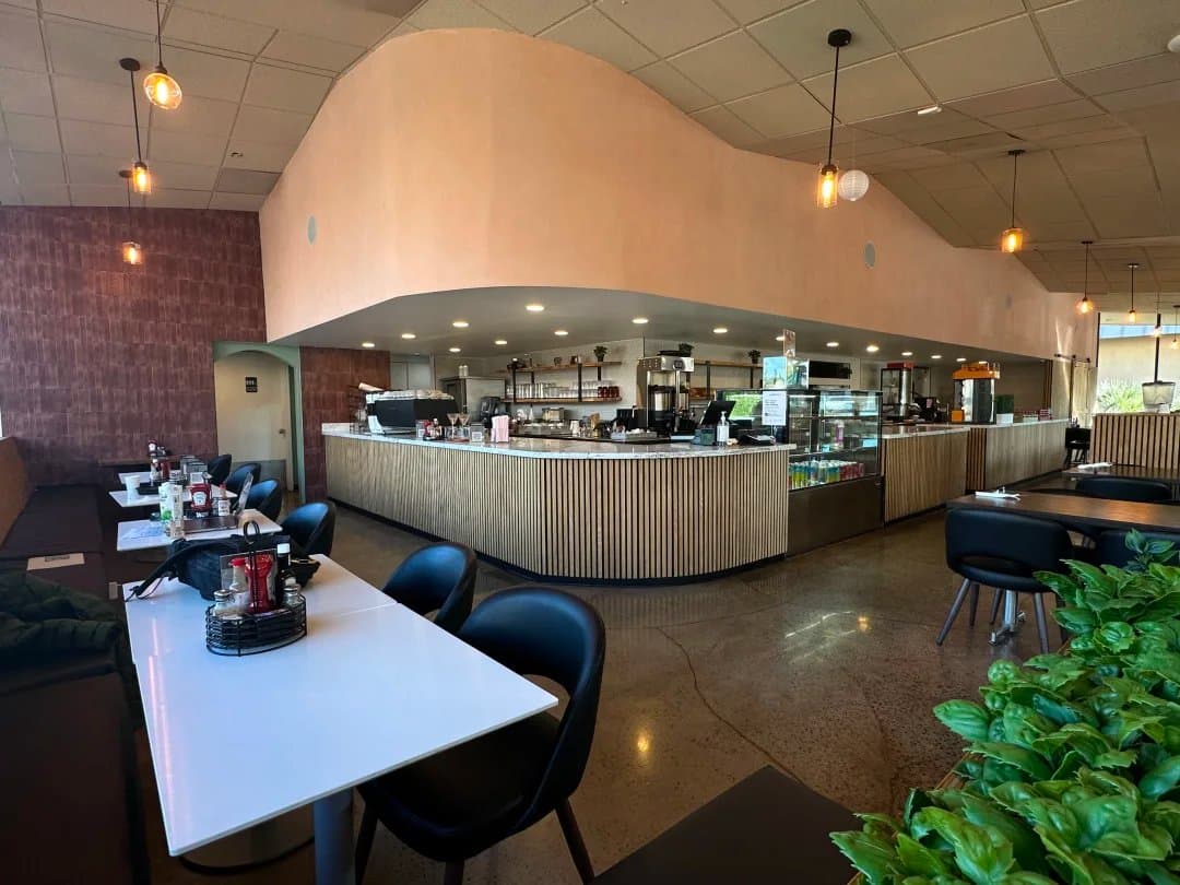 Front counter and espresso bar — check-in area, buffet, or dessert bar for your event